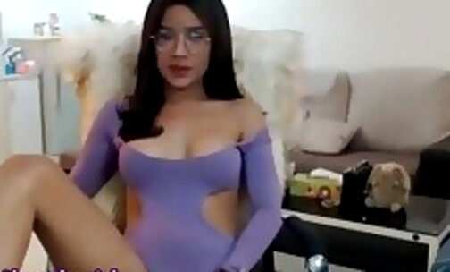 sexy Thailand shemale in glasses strokes her big cock on webcam