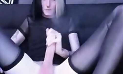 slim tattooed tgirl in stockings strokes her big cock on webcam