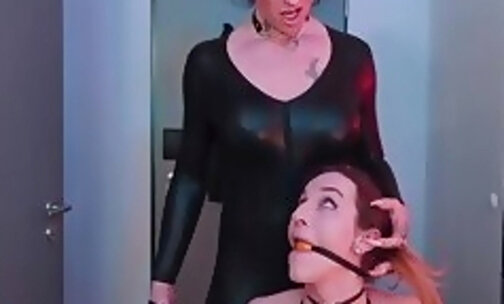 Cruel shemale mistress playing with submissive one