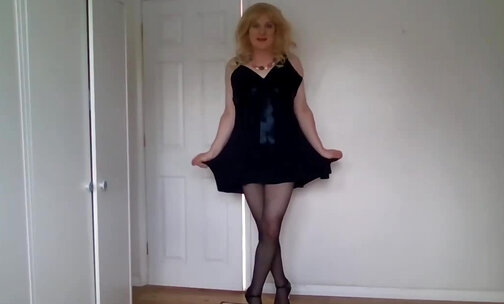Stripping naked out of a black dress and pantyhose