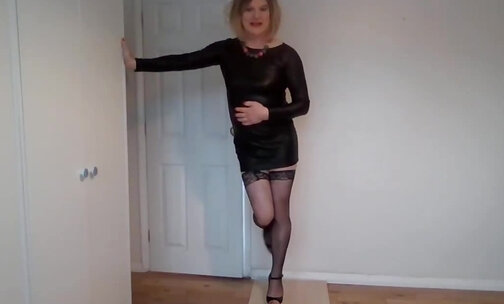 Black stockings, leather minidress and heels