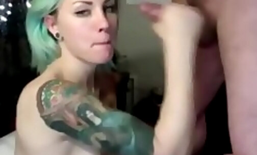 Stunning green haired shemale devouring cock