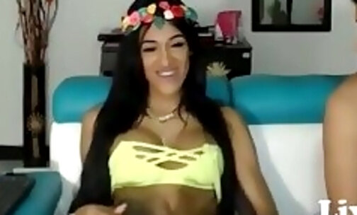 Beautiful Latin shemale jerking off next to her bf