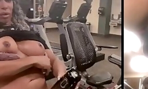 Using her sex toy to shoot a cumshot while working out in the gym