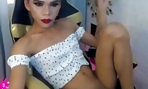 skinny Filipina TS with tattoos strokes her cock on webcam