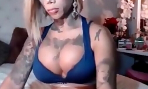 Blond shemale with huge tits masturbates for you