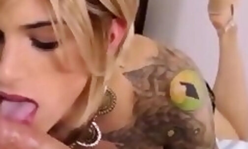 Tattooed blond tranny blows and grinds cock - pov