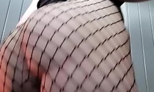 Her pp is sticking out of her fishnets