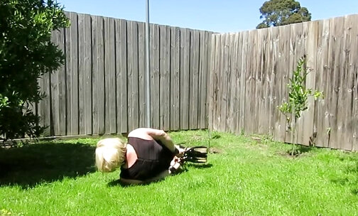 Daisy hogtied in back yard and cums