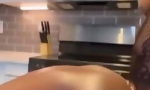 Busty ebony shemale humiliates a dude in the kitchen