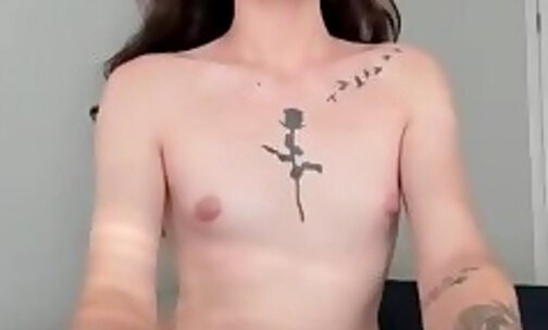 slim tattooed tgirl in fishnet stockings shows her hot body on webcam