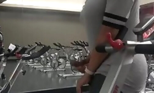 Stroking her big cock in the gym and shooting a cumshot
