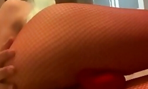 EmilyBlue in fishnet leggings, sucking and teasing her asshole