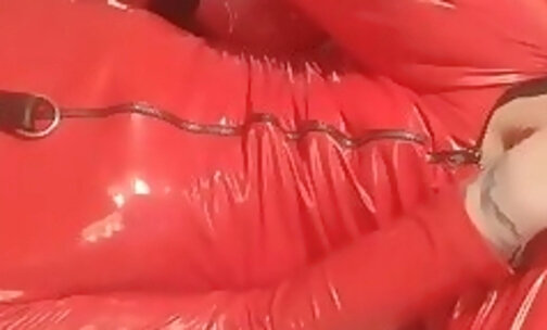 Sissy in red pvc cat suit used by rubber suited Dom xh5