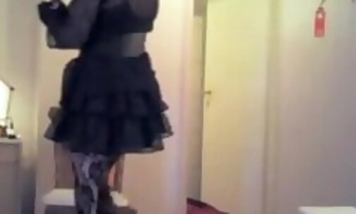 Analisa in heels, stockings and frilly sissy dress drinks her own piss